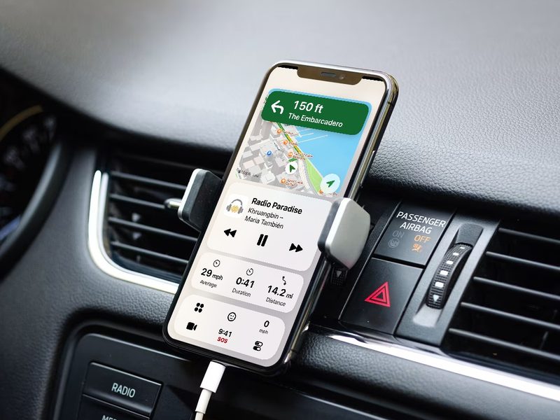 An iPhone 11 running CarOS on a vent mount, above a car stereo with no screen: directions, the radio and the trip